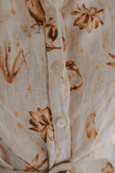 The Michelle Turner Bird Print Caramel Short Sleeve Dress