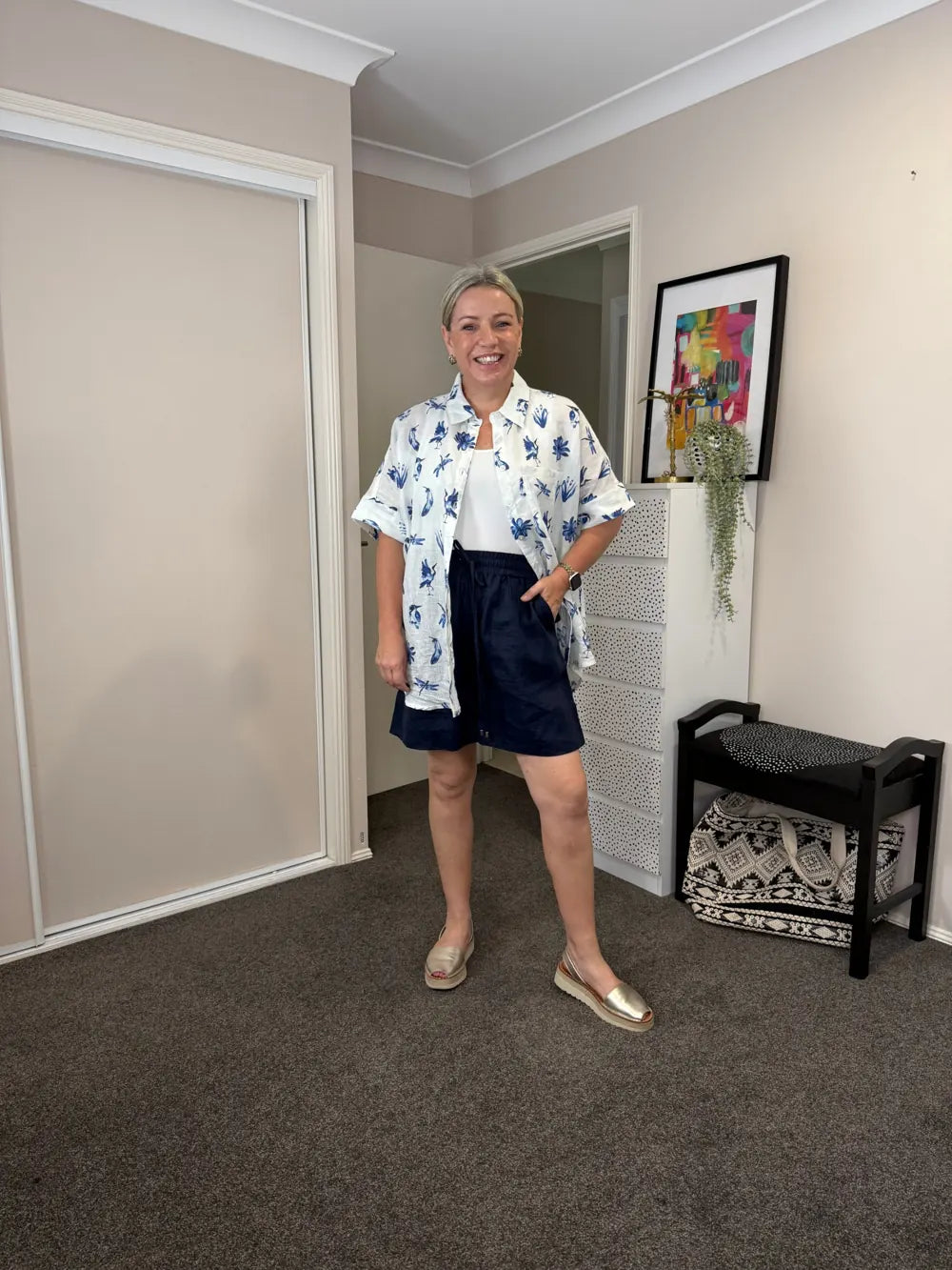 Kelly, 165cm, wearing size 12 Navy Everyday Linen Shorts