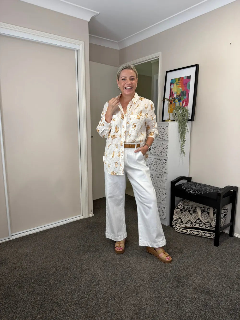 Kelly, 165cm, wearing size 10 Golden Flight Linen Shirt